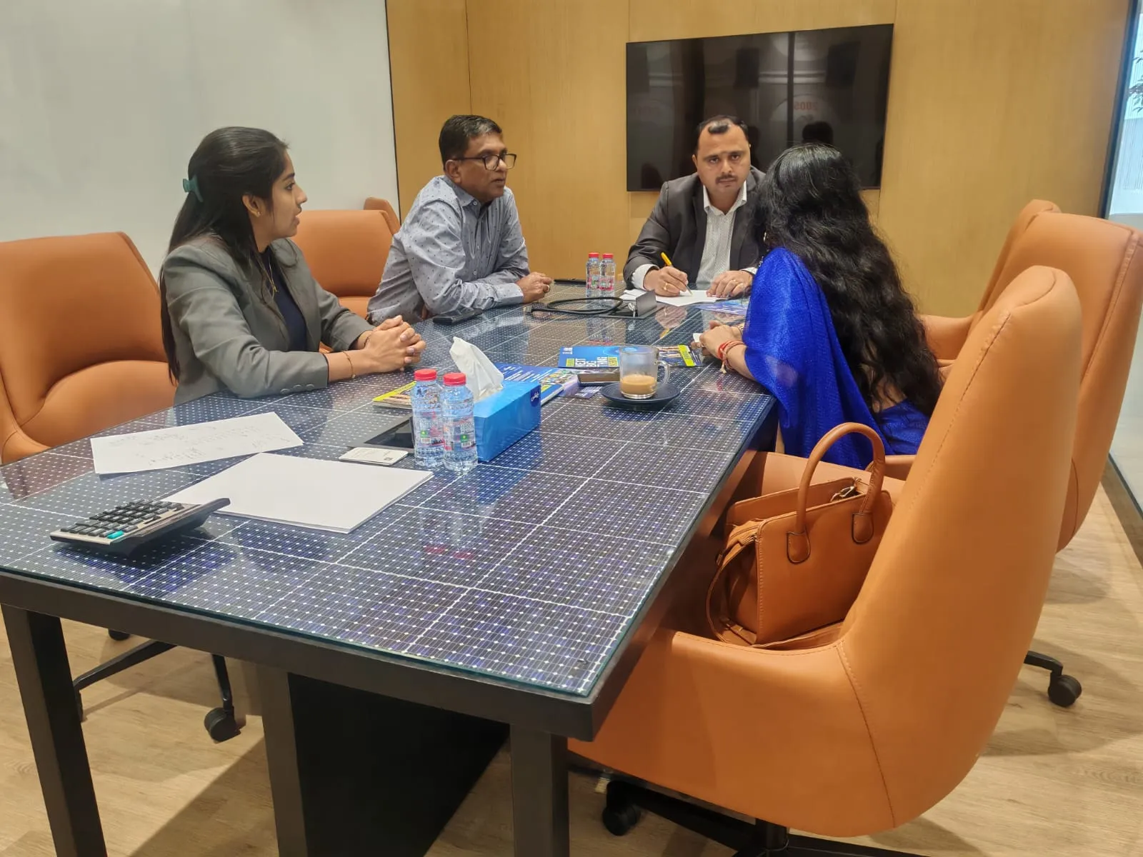 Buyers reviewing plans with the Urbanrise team