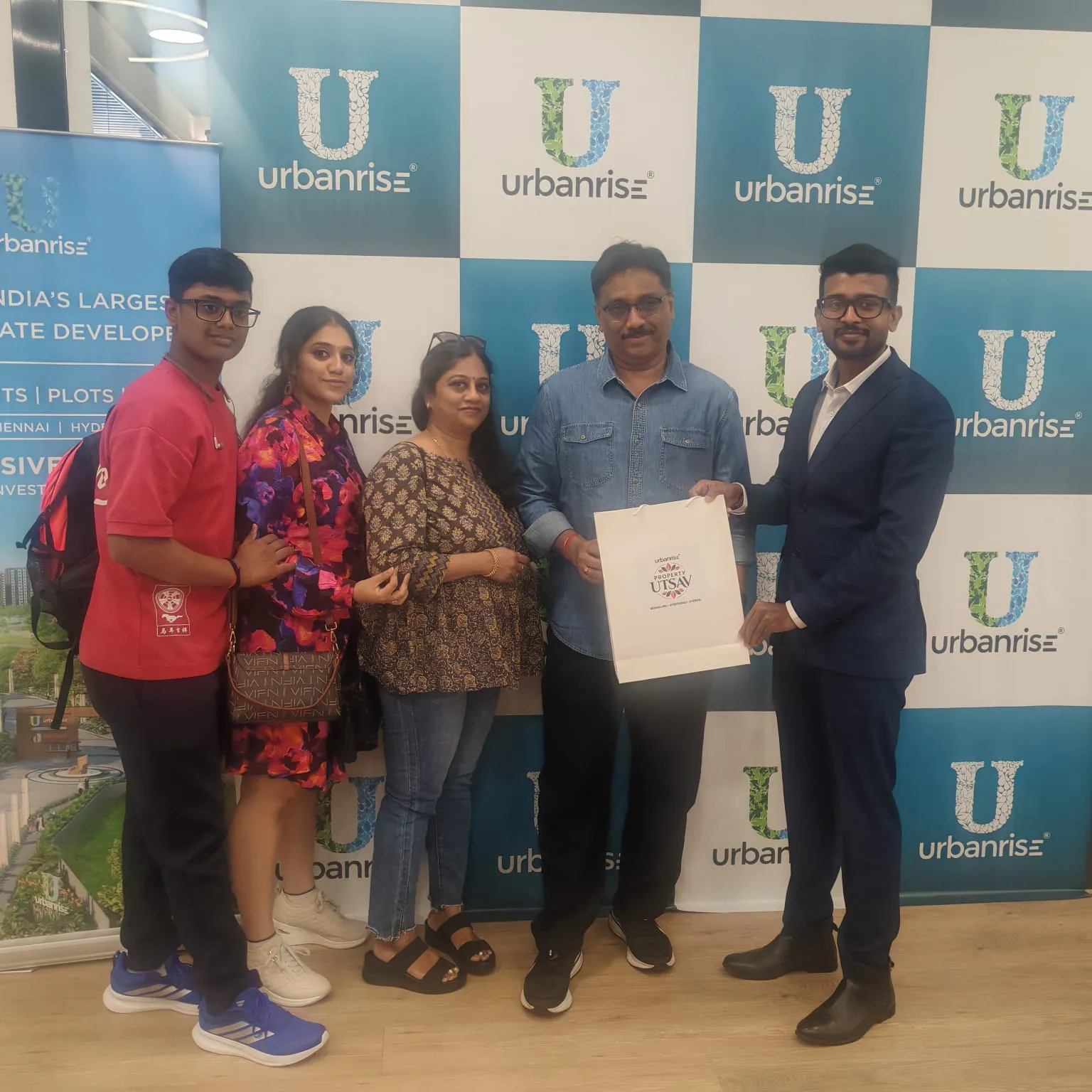 A family receiving their Property Utsav bag