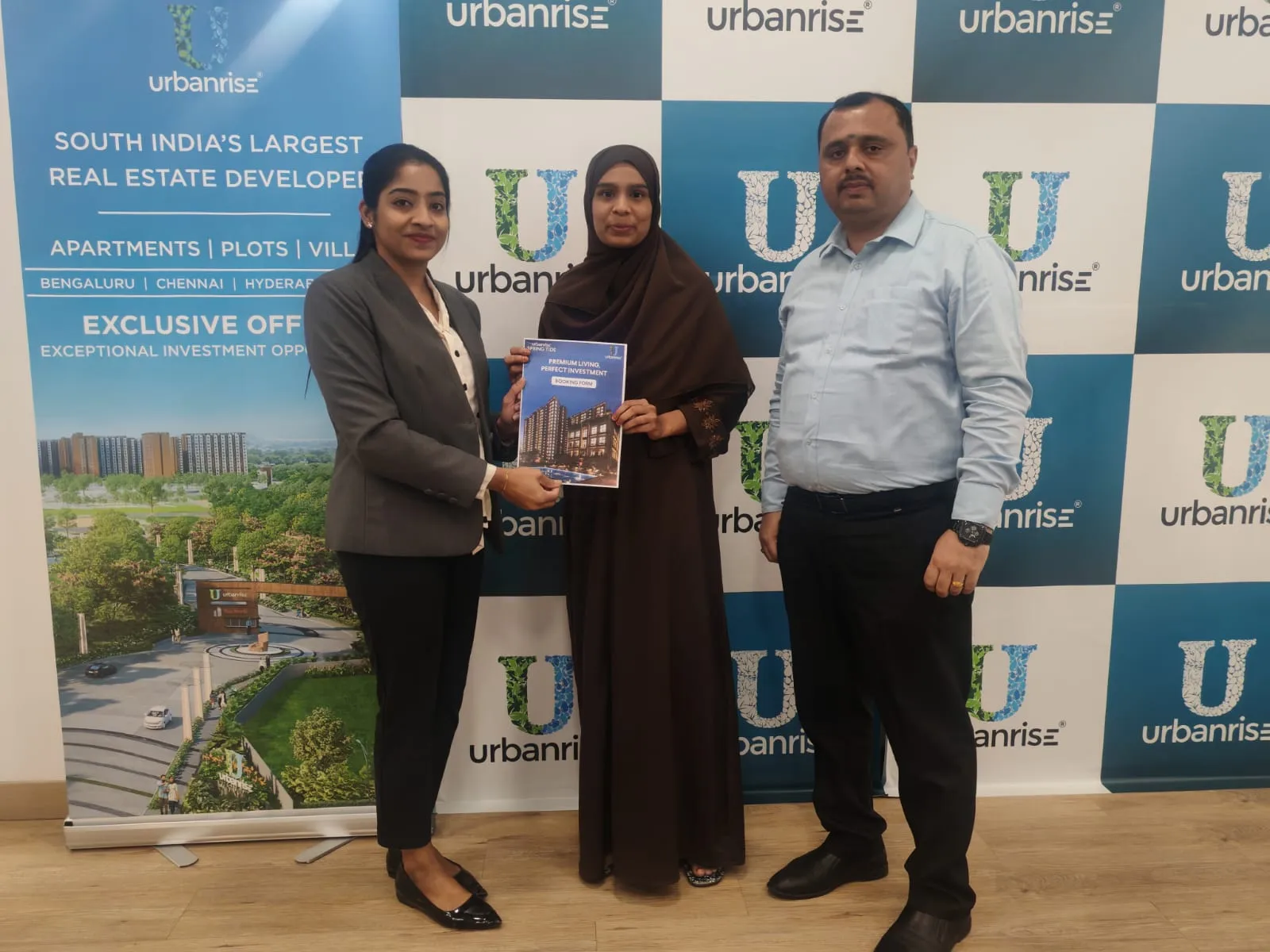 A buyer holding her booking form with the Urbanrise team