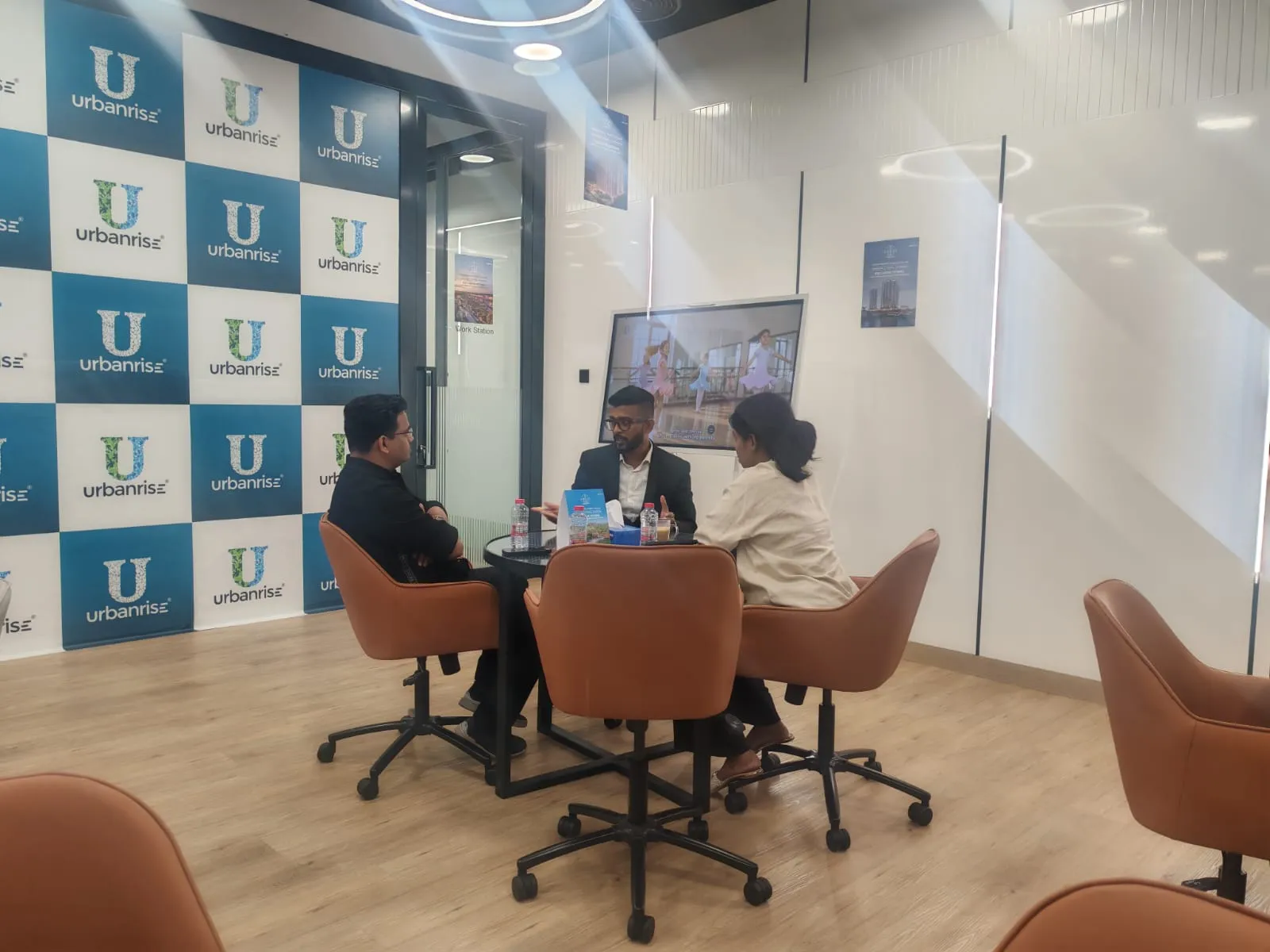 A couple in consultation with an Urbanrise representative